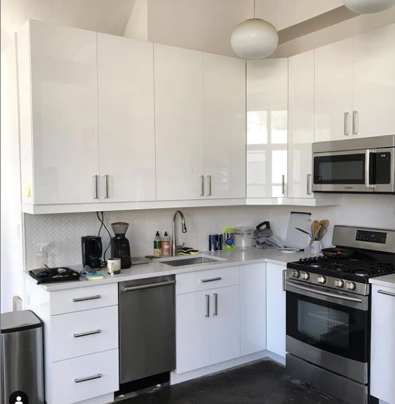 White Gloss Kitchen Cabinets for a Downtown Brooklyn Condo in Brooklyn designed by Total Kitchen Outfitters