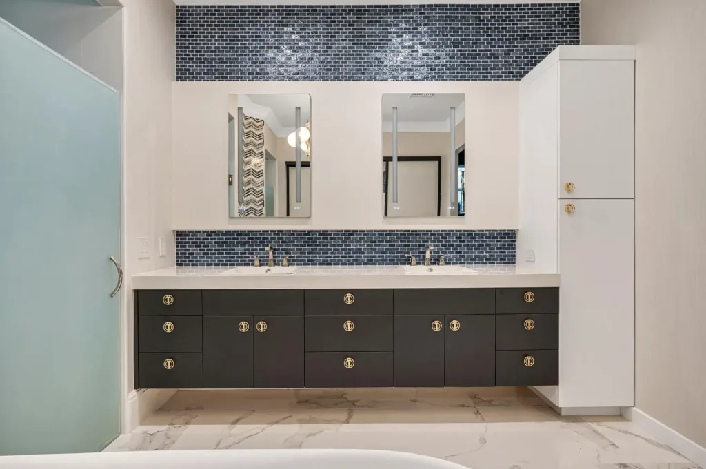 dark cabinets and a light countertop create elegance for this modern bath design