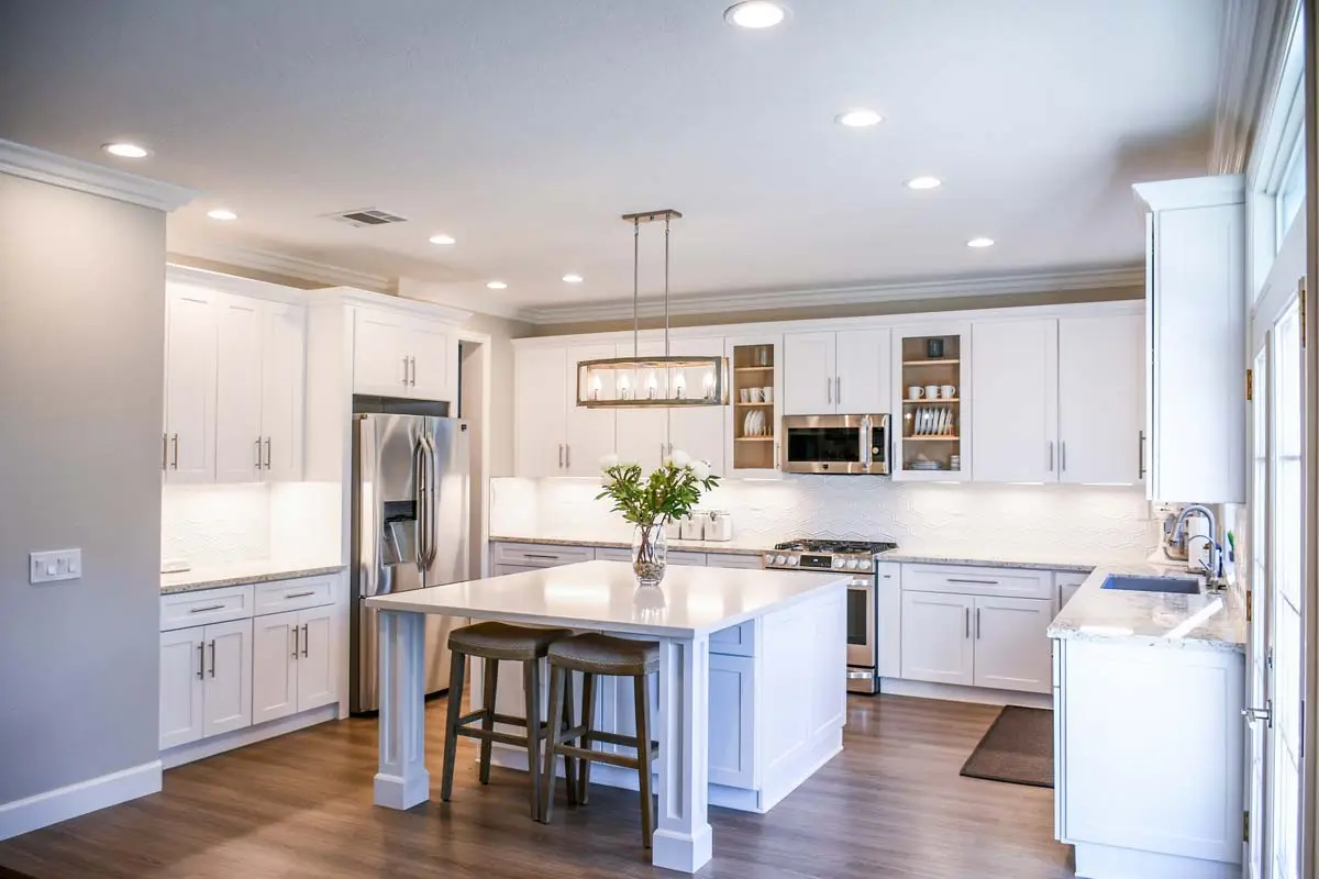 White cabinets in a U shape for a transitional kitchen