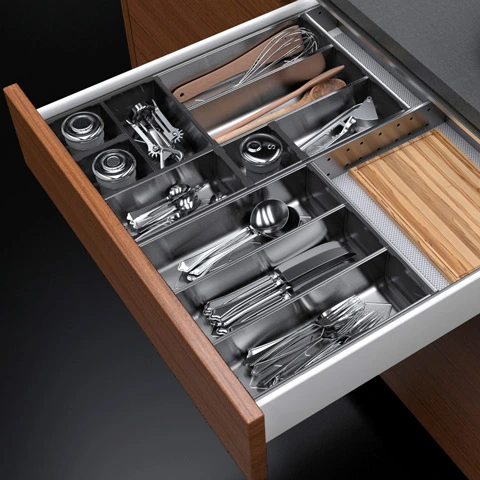 Use a drawer organization system available in various finishes to organize your cutlery and utensils.
