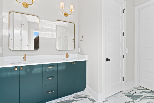 Bathroom with bold green cabinetry
