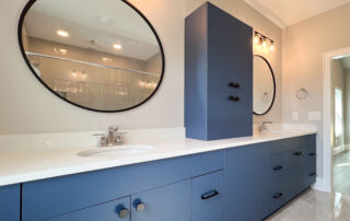 bathroom with deep blue cabinets