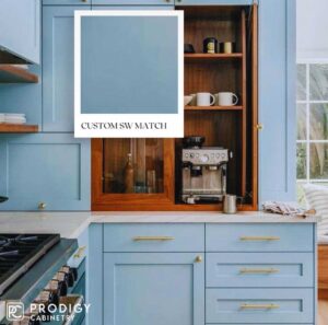 Stylish kitchen with custom blue cabinets and wooden accents, featuring Custom SW Match by Prodigy Cabinetry.