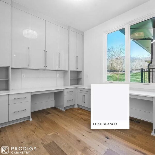 Modern luxury kitchen with white cabinetry by Prodigy Cabinetry featuring the Luxe Blanco finish.